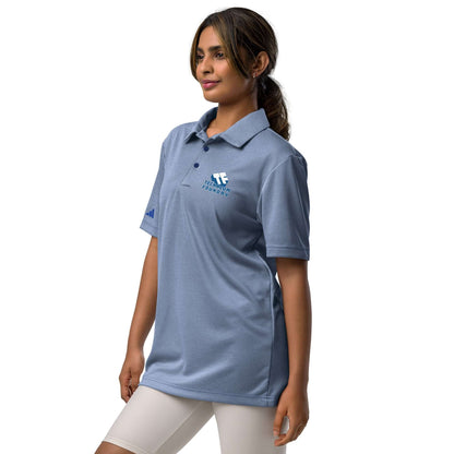 Woman wearing Adidas Spin Science athletic polo shirt, blue design