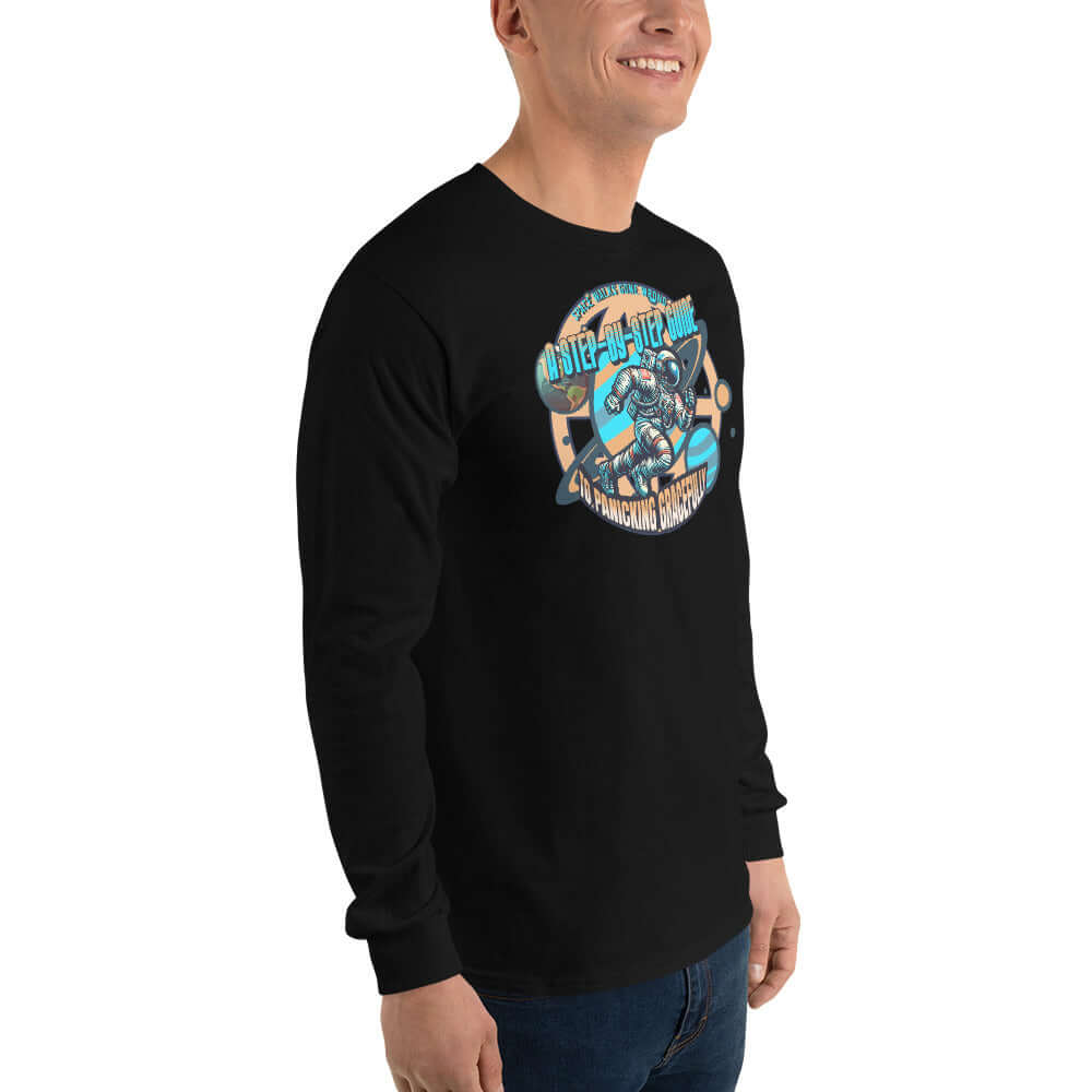 Space Walks Gone Wrong Long Sleeve Tee with astronaut art in cosmic golds on black fabric, ideal for space enthusiasts.