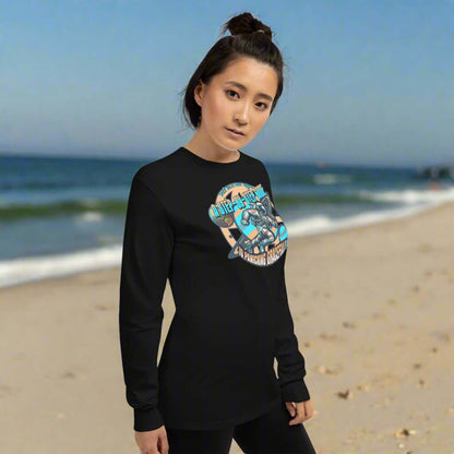 Woman wearing Space Walks Gone Wrong long sleeve tee with astronaut print, standing on beach.