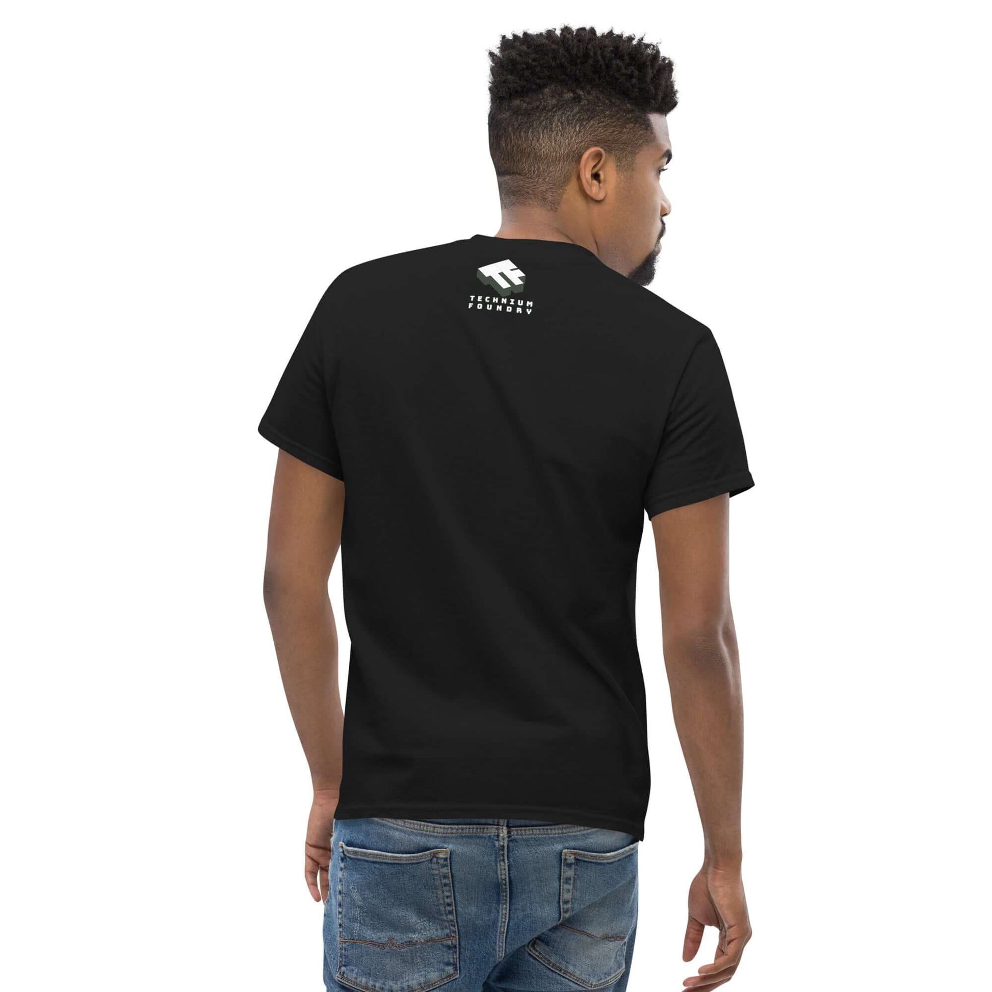 Black t-shirt with white logo on the back, worn by man in jeans, showcasing casual fit and style.