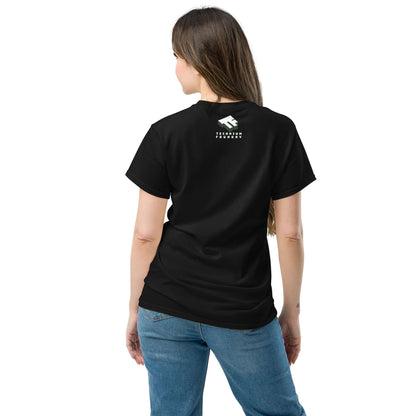 Woman wearing Space Tourist T-Shirt with alien vacation design, featuring text on the back, black tee and blue jeans combination.