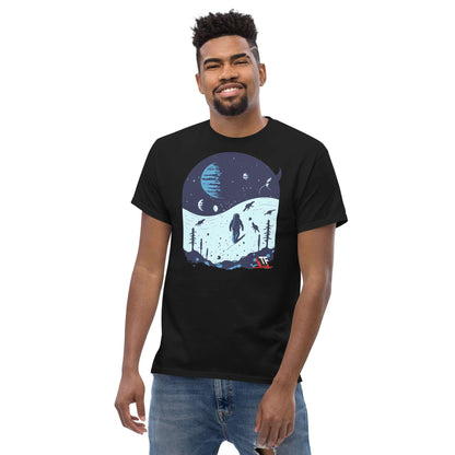 Man wearing Space Dinosaur Slopes T-Shirt by Technium Foundry, featuring astronaut and T-Rex skiing in space scenery.