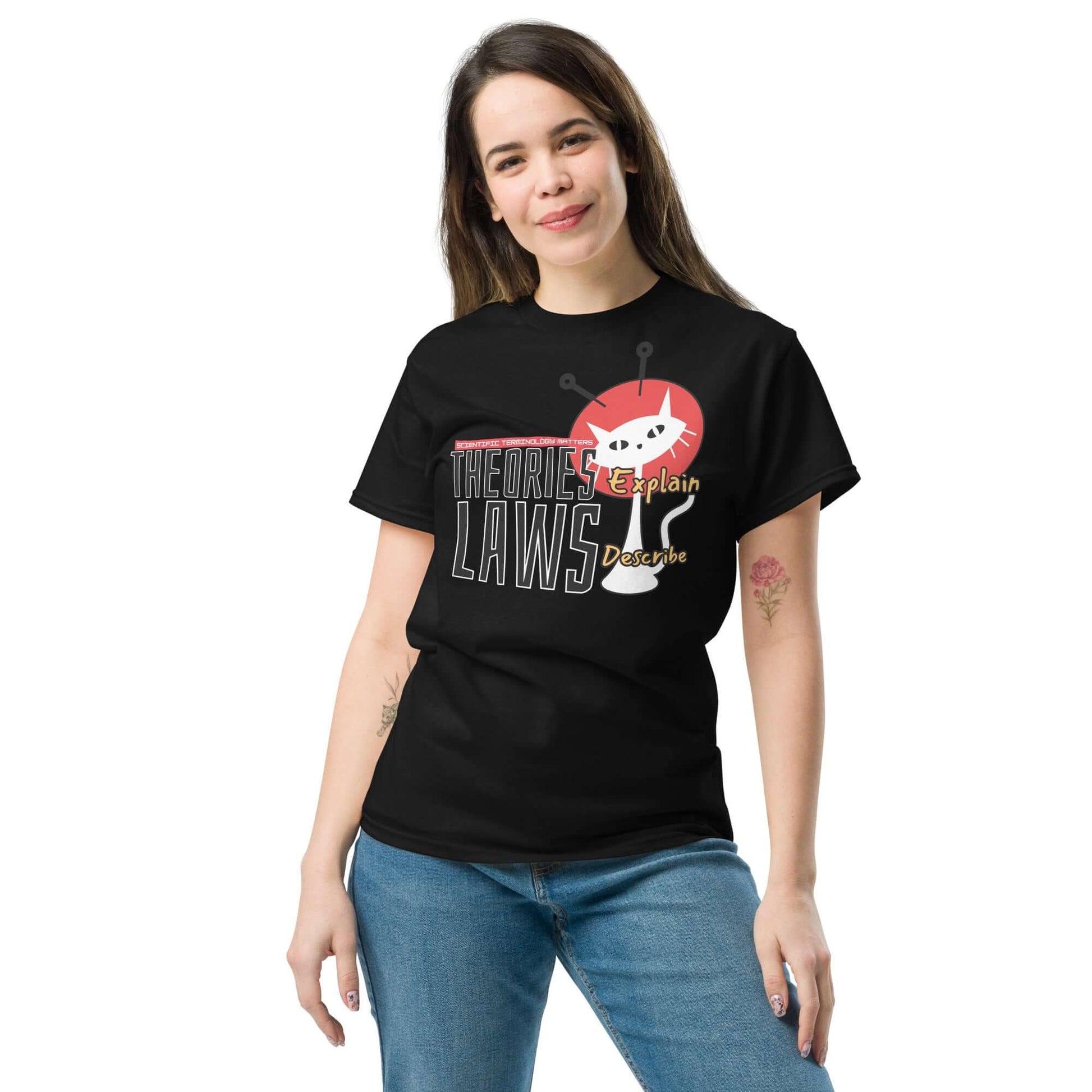 Woman wearing "Theories Explain, Laws Describe" Tee featuring scientific cat illustration from Technium Foundry's Science & Tech Apparel Collection.