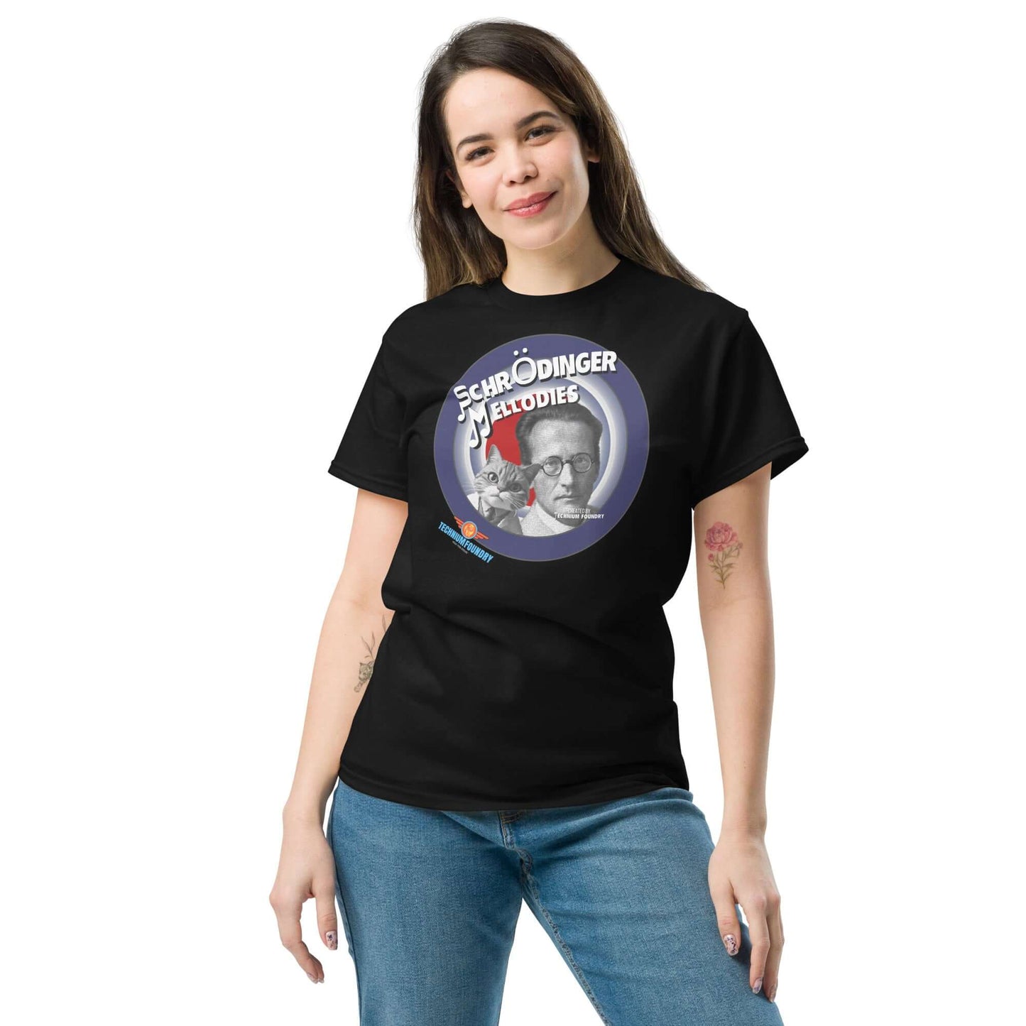 Woman wearing "Schrödinger's Melodies" tee featuring Erwin Schrödinger with a quantum music design on black shirt.