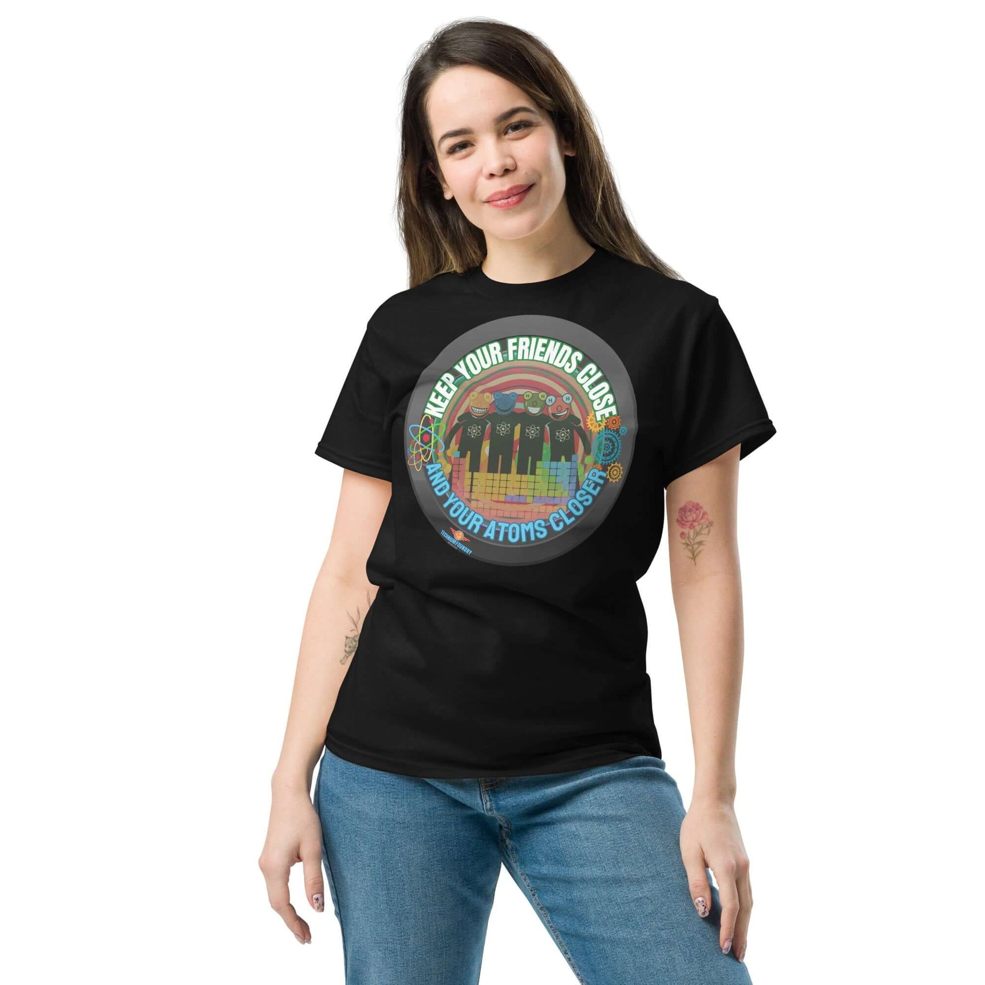 Woman wearing "Keep Your Friends Close and Your Atoms Closer" tee with retro-circle atom design and cityscape backdrop.