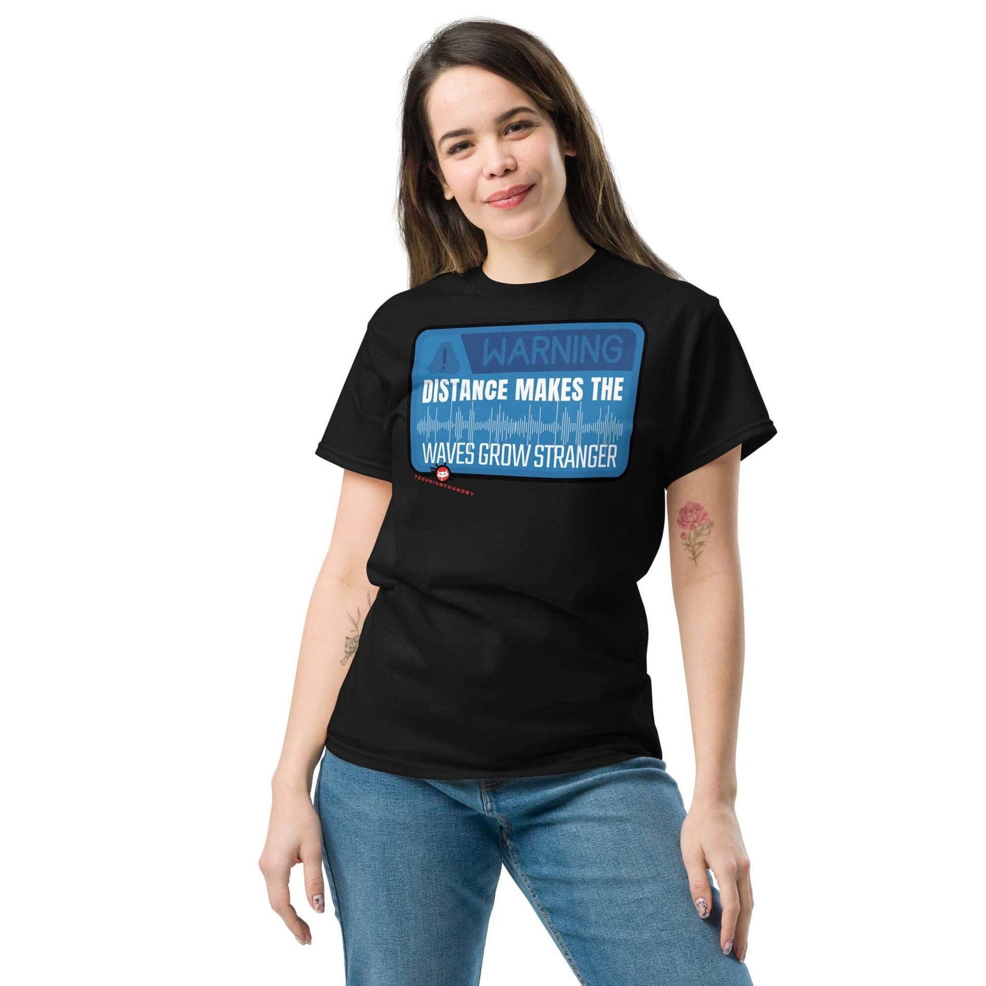 Woman wearing Technium Foundry "Warning: Waves Get Stronger" graphic T-shirt with fun physics theme.