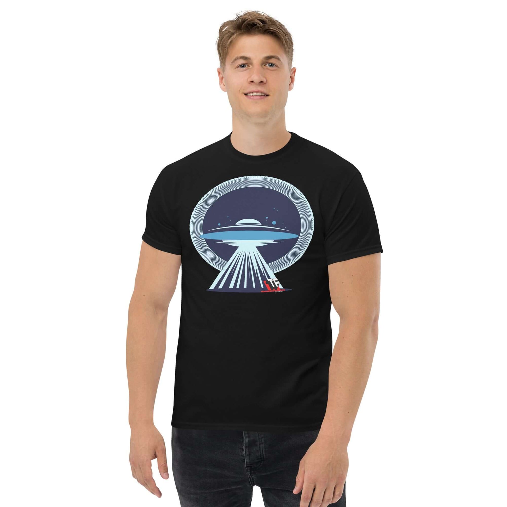 Man wearing a black T-shirt with a UFO beaming up a red sleigh, blending alien technology and holiday cheer, by Technium Foundry.