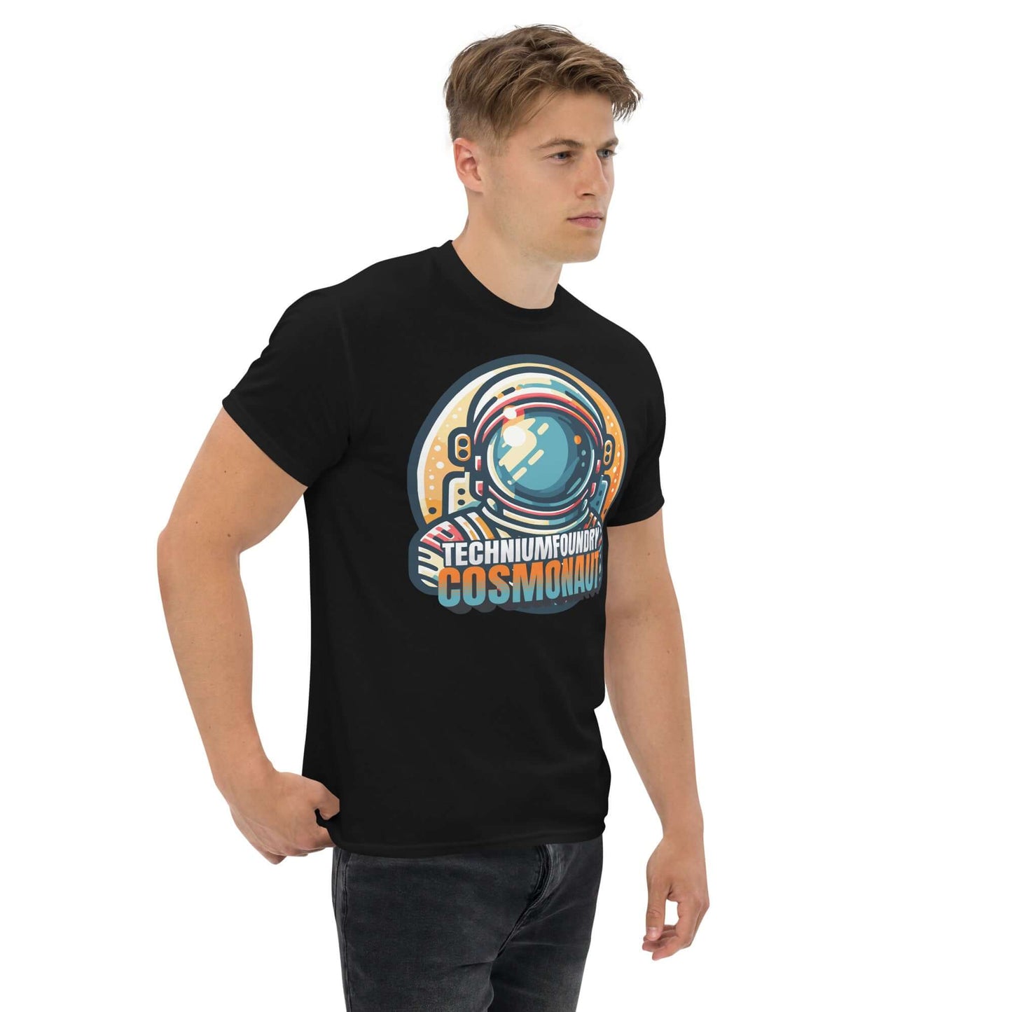 Man wearing Technium Foundry Cosmonaut T-Shirt with vintage astronaut helmet design and retro color palette.