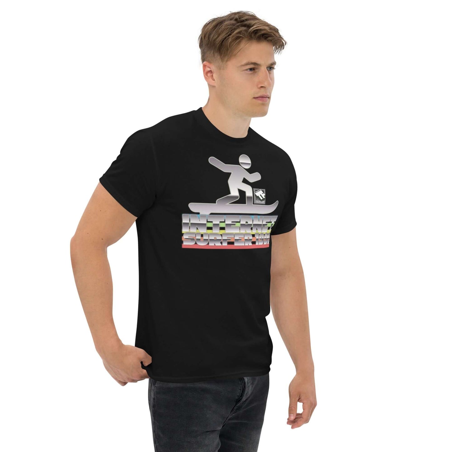 Man wearing black Internet Surfer 1999 T-Shirt featuring a chrome digital wave rider and vintage typography by Technium Foundry.