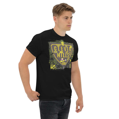 Model wearing Clever Hills T-Shirt with shield design blending quantum mechanics and Beverly Hills, on black fabric.