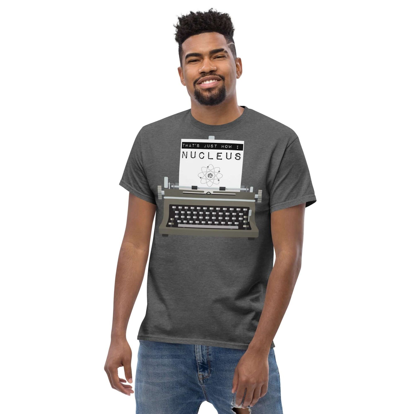 Man wearing "That's Just How I Nucleus" tee with vintage typewriter and atomic pun design.