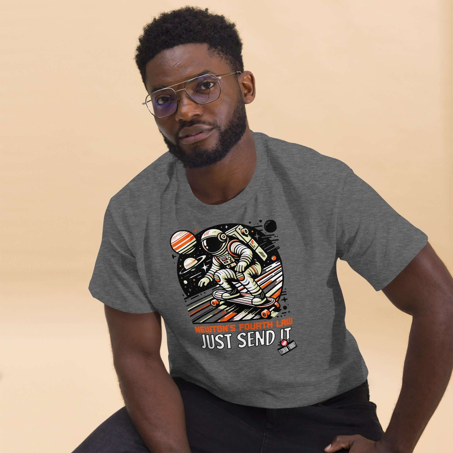 Man wearing Newton's Fourth Law "Just Send It" T-shirt by Technium Foundry featuring a cosmic skater design.