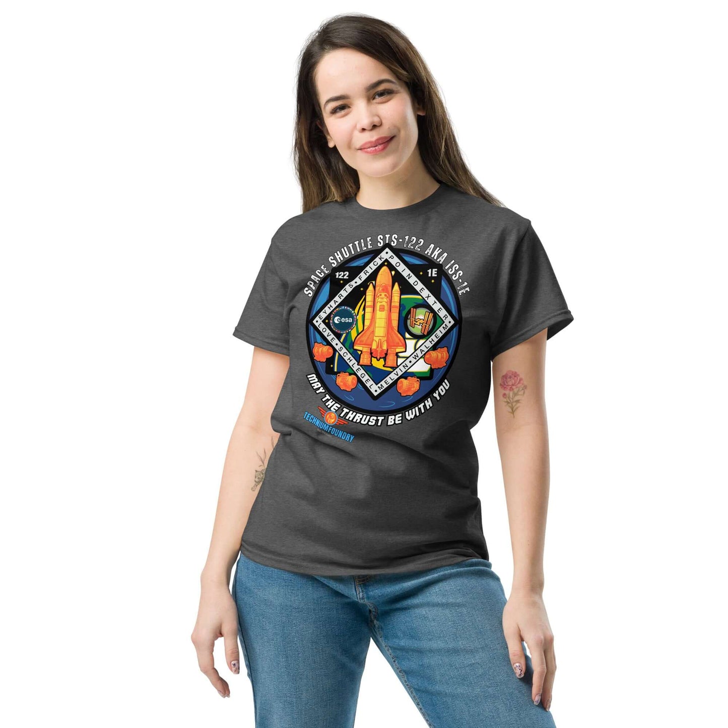 Woman wearing "May The Thrust Be With You" Space Shuttle Tee, featuring STS-122 mission patch design. Science & Tech Apparel Collection.