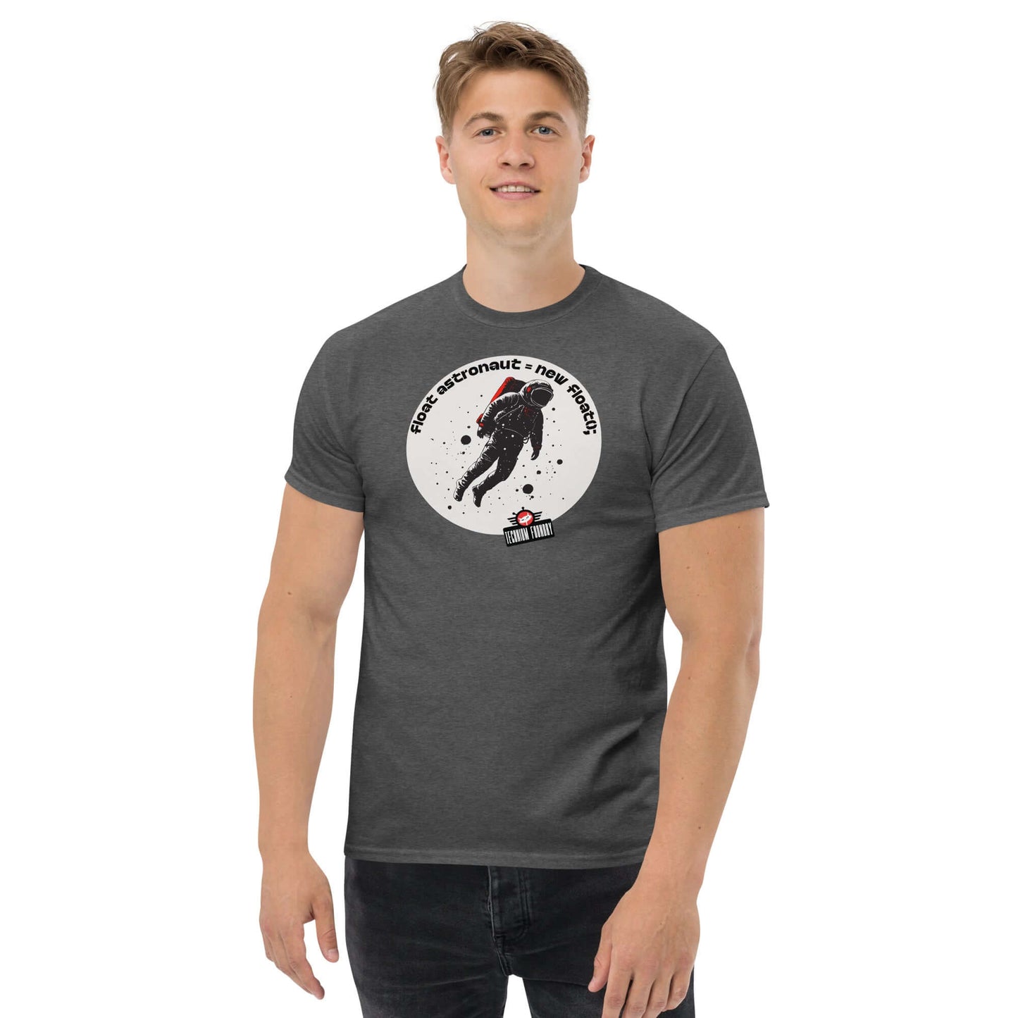 Man wearing a "First Astronaut = New Branch();" T-shirt by Technium Foundry, featuring a space explorer design on a dark background.