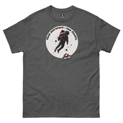 Dark grey T-shirt featuring a minimalist astronaut graphic with the text "First Astronaut = New Branch();" from Technium Foundry.