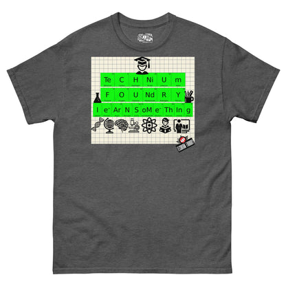 Technium Foundry Learn Something T-shirt featuring periodic table design on graph paper with educational icons in gray color.