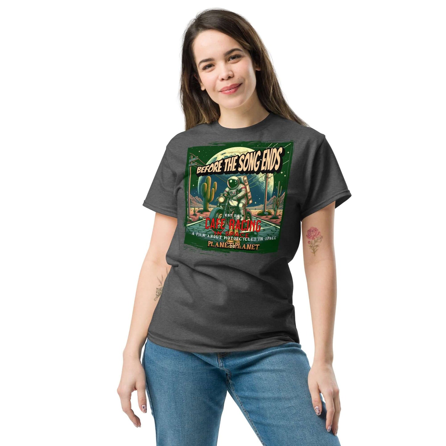 Woman wearing Cafe Racer Space T-Shirt with vintage motorcycle astronaut design, Southwestern desert, and celestial background.