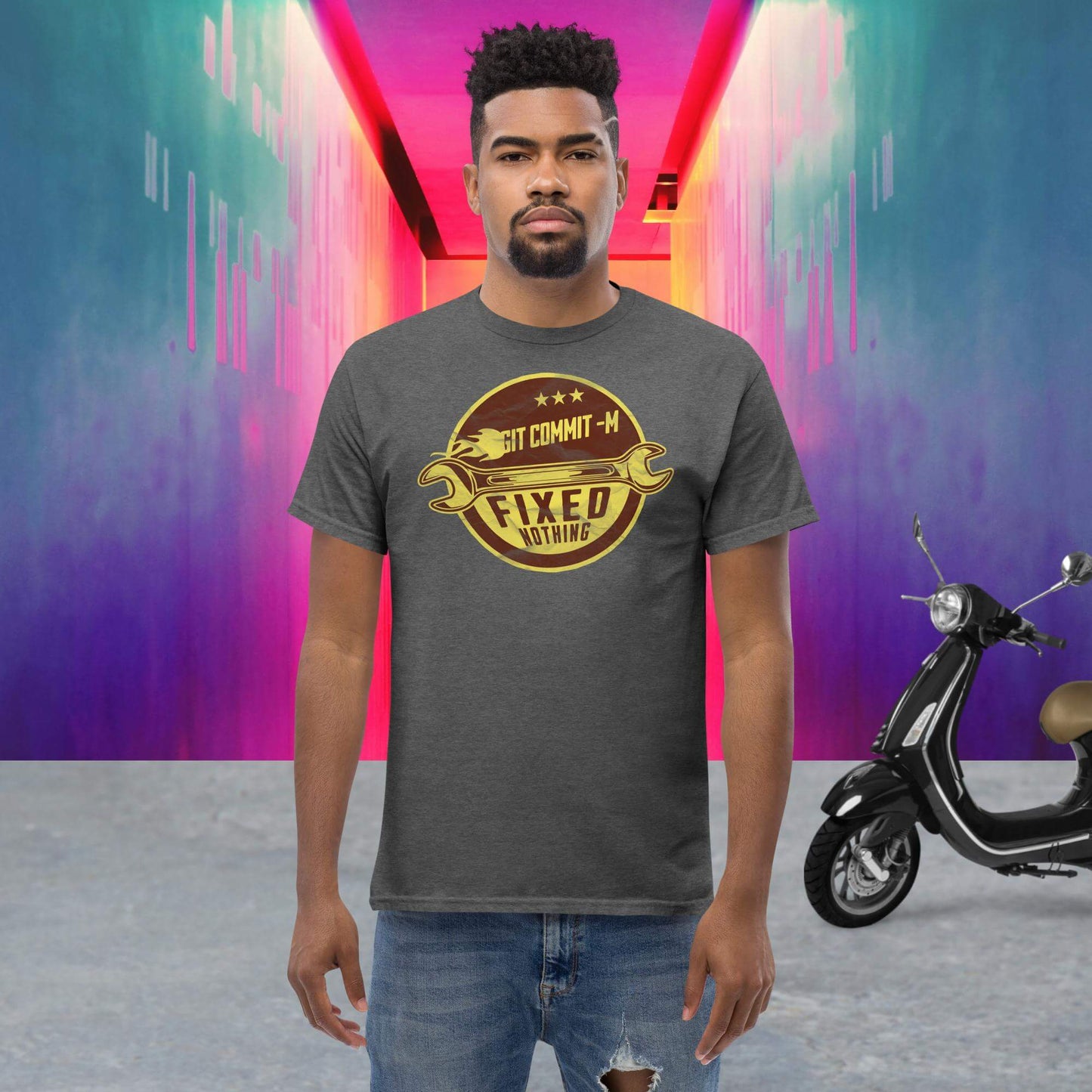 Man wearing Git Commit 'Fixed Nothing' T-shirt with crossed wrenches design, standing in colorful urban background.