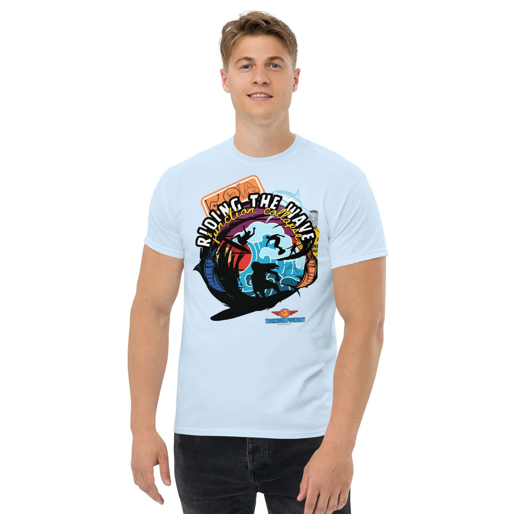 "Riding The Wave" Tee from Technium Foundry, featuring a colorful design merging particle physics with surfing vibes. Science & Tech Apparel Collection.