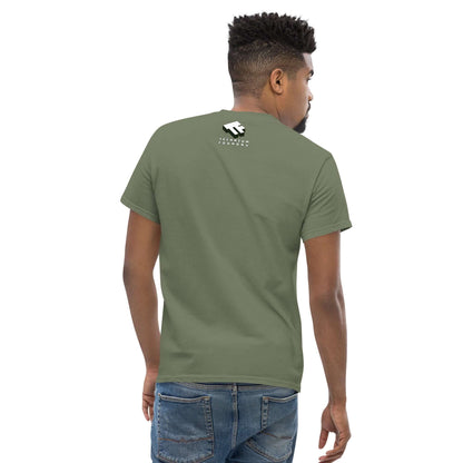 Back view of man wearing olive green t-shirt with white minimalist logo design, paired with blue jeans.