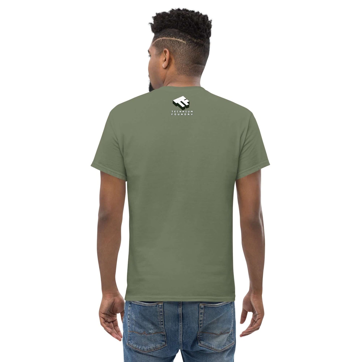 Man wearing olive green Garage Cold Fusion T-Shirt with a white logo on the back.