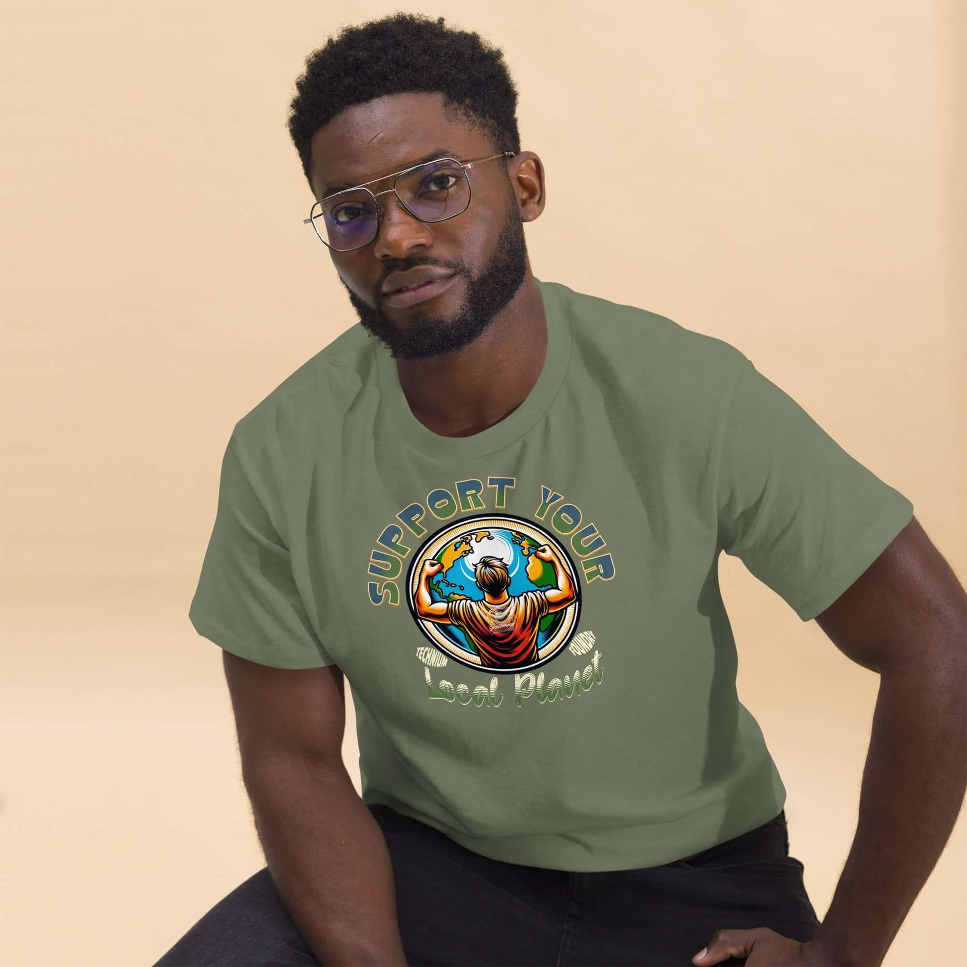 Man wearing "Support Your Local Planet" T-shirt by Technium Foundry, showcasing an eco-conscious design.