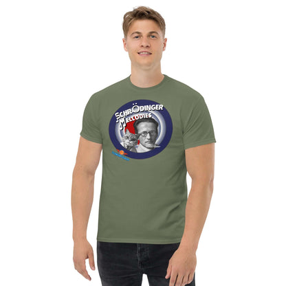 Man wearing green "Schrödinger's Melodies" tee with playful quantum physics and music mashup design.