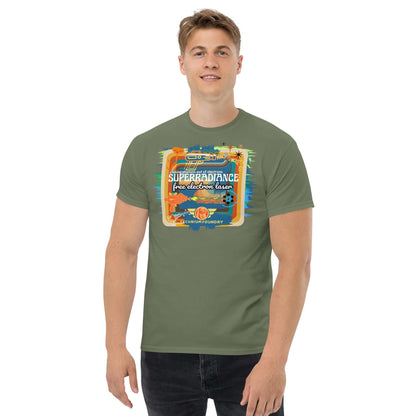 Man wearing Superradiance Free Electron Laser T-Shirt, featuring retro 1980s-style quantum physics design on green fabric.