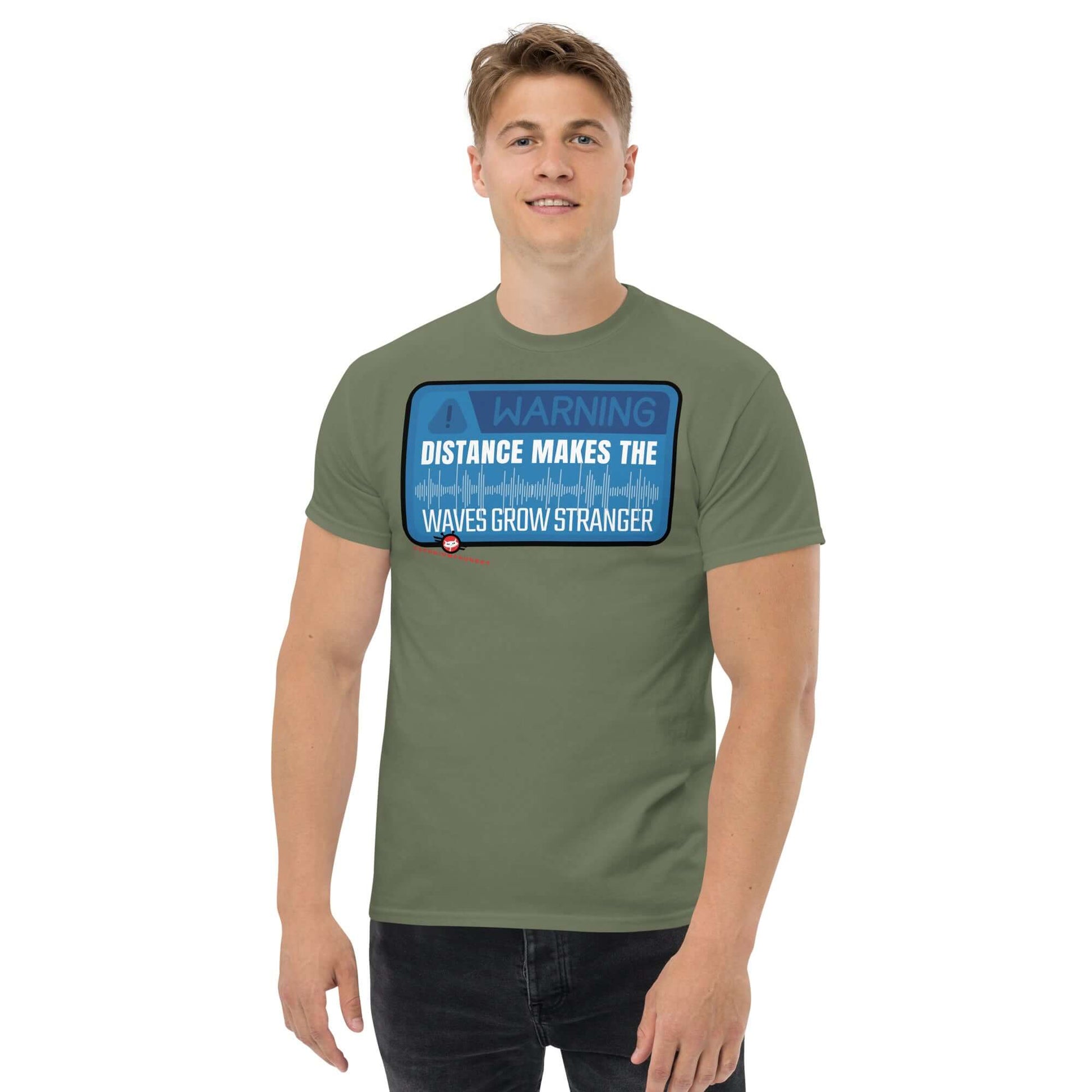 Man wearing "Warning: Distance Makes Waves Grow Stronger" T-shirt by Technium Foundry, quantum apparel, science geek shirts.