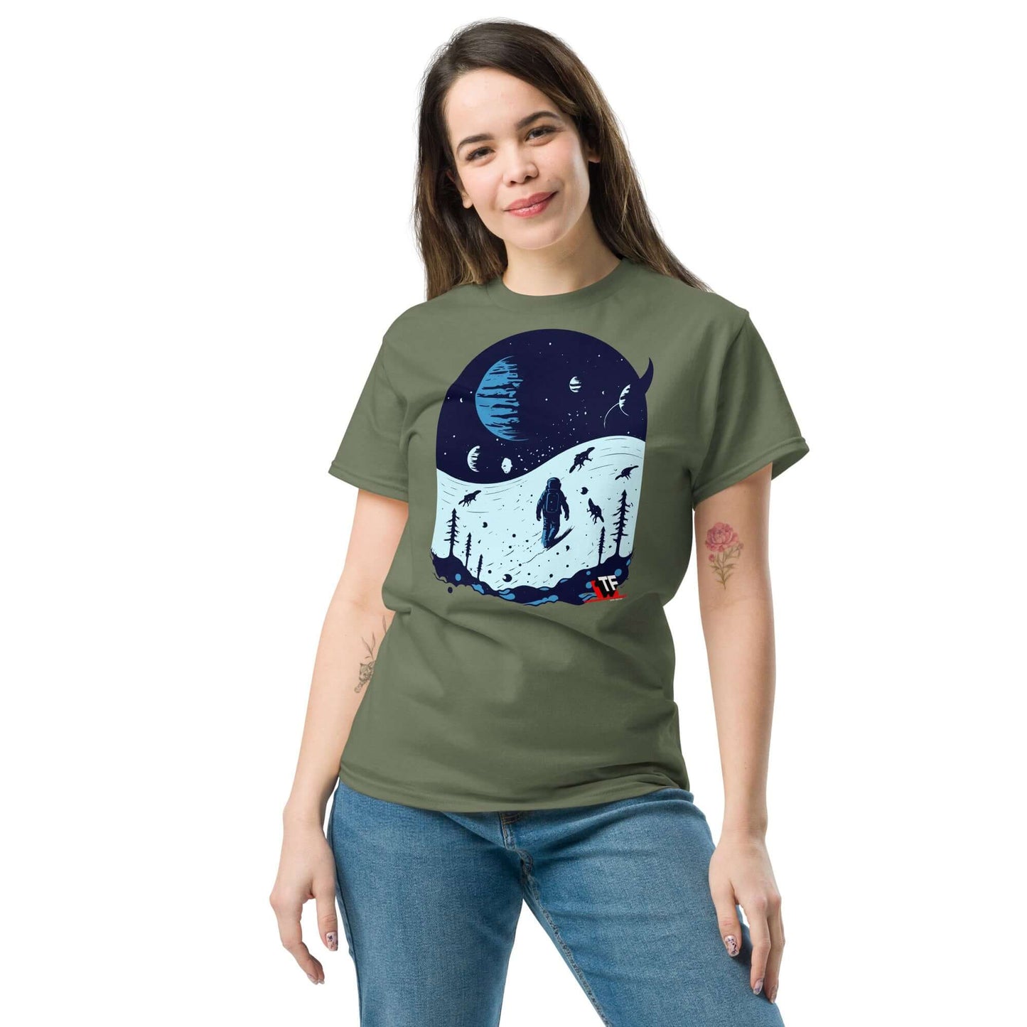 Woman wearing Space Dinosaur Slopes T-Shirt featuring T-Rex skiing on alien planets, by Technium Foundry.