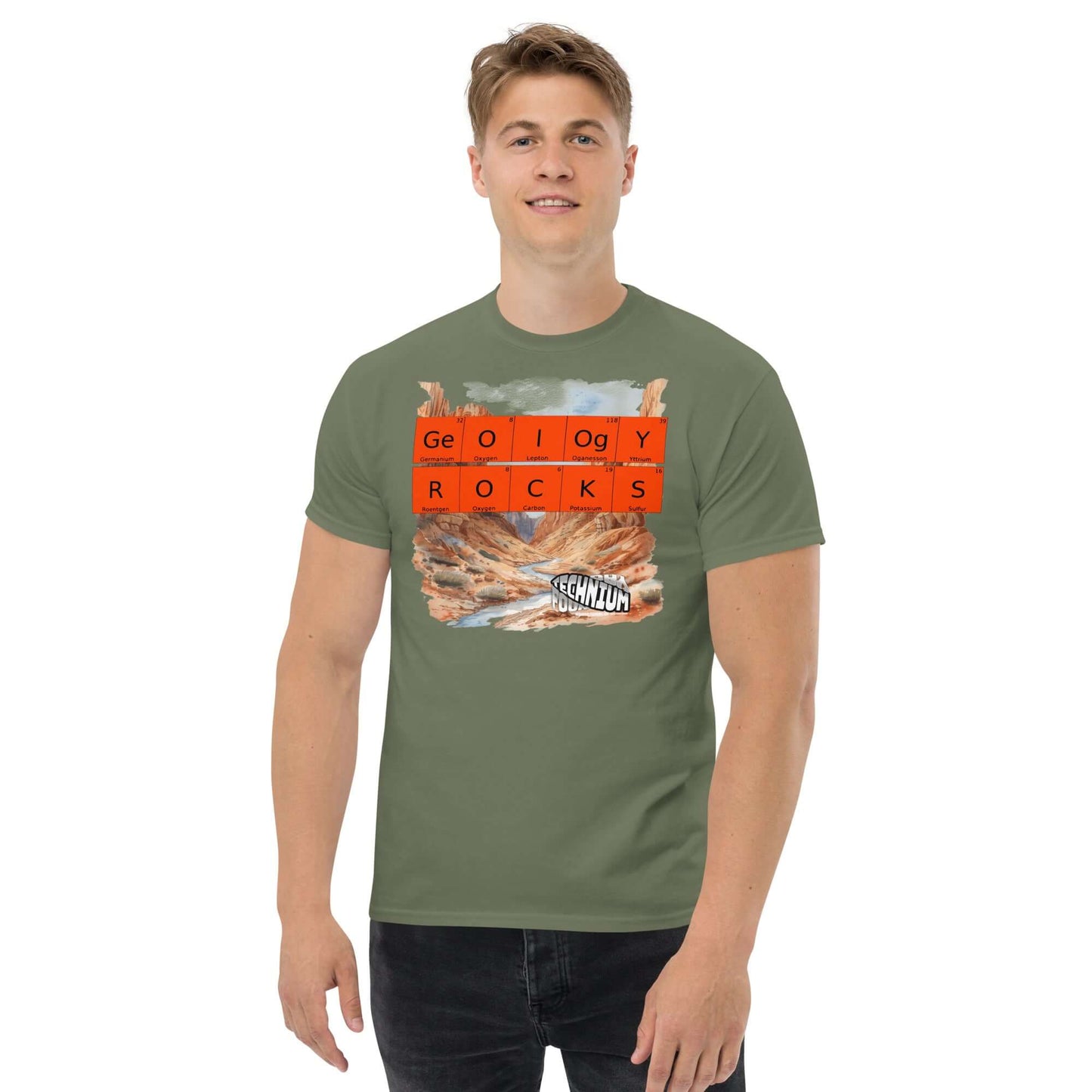 Man wearing green "GEOLOGY ROCKS" T-shirt by Technium Foundry with periodic elements, showcasing a geology-themed design.