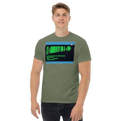 Person wearing a green T-shirt with "Currently On a <br>" HTML humor design, featuring terminal green text on a browser window graphic.