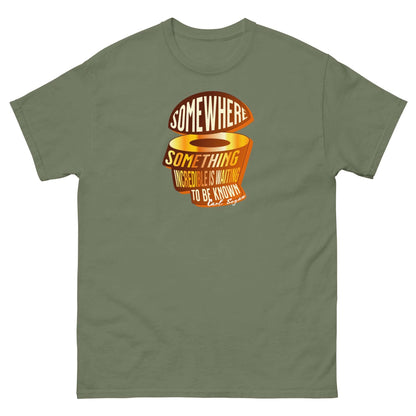 "Somewhere, Something Incredible Carl Sagan T-Shirt in olive with cosmic quote design in sunset hues."