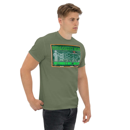 Man wearing "Biologist Mode Life Finds A Way" T-shirt featuring DNA design and science humor on a green background.