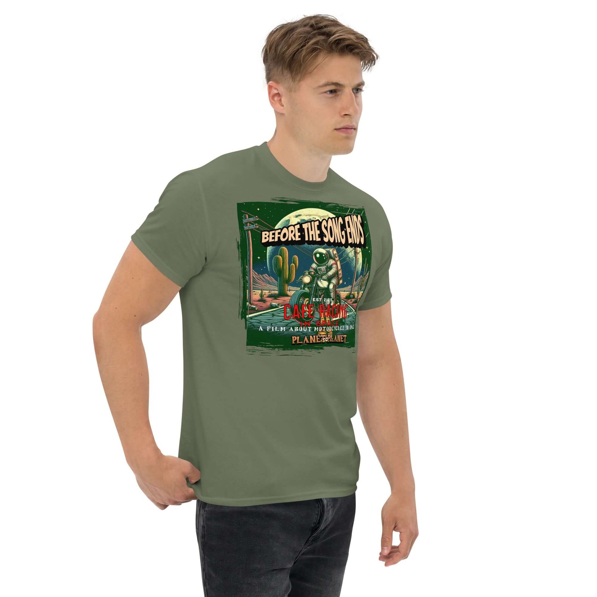 Man wearing Cafe Racer Space T-Shirt featuring astronaut and desert scene in vintage style.