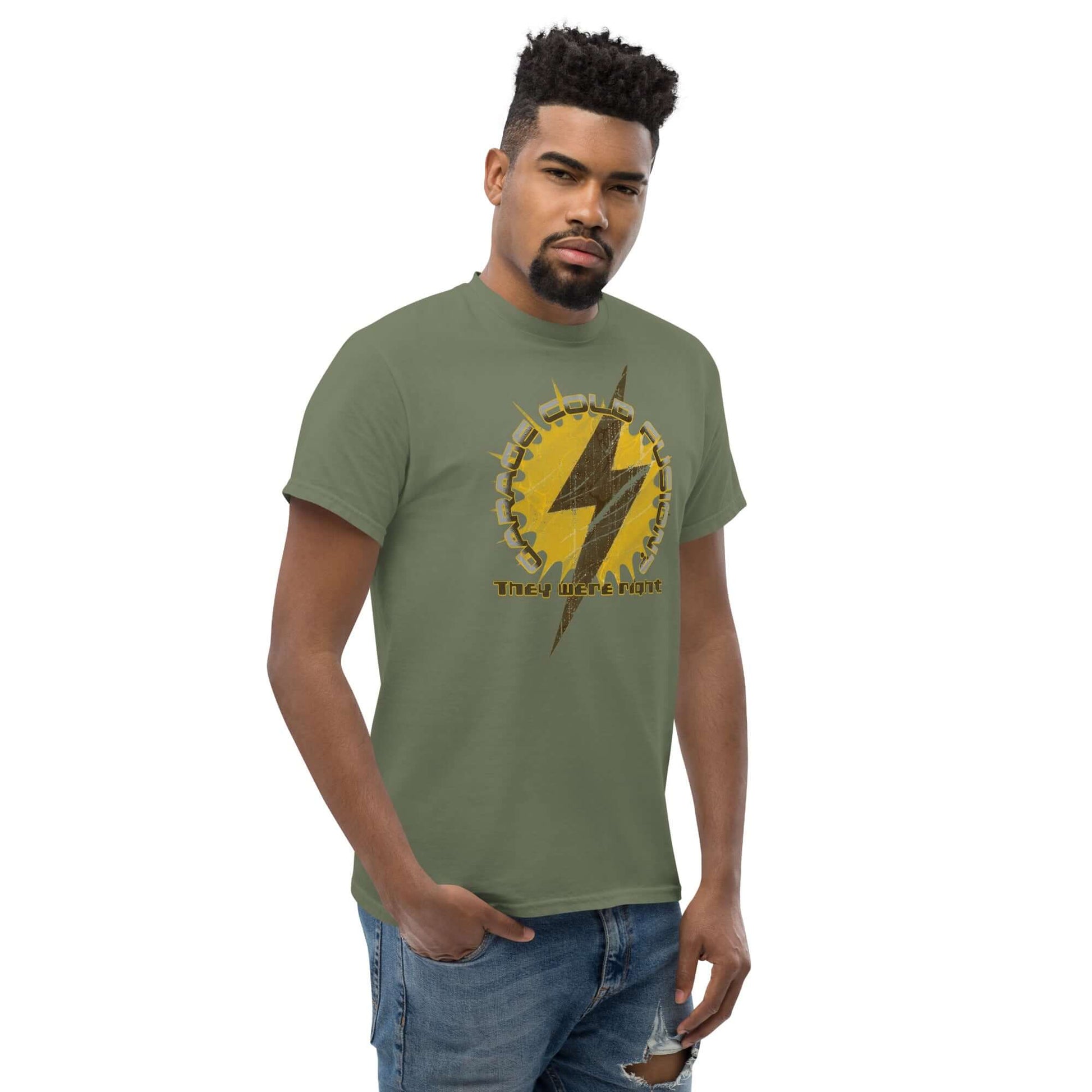 Man wearing Garage Cold Fusion T-Shirt with lightning bolt and gear design, humorous science experiment tee.