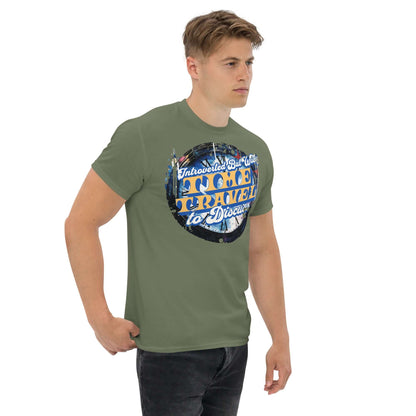 Model wearing Introverted Time Travel T-Shirt with a vintage design, blending humor in physics and social boundaries on an olive tee.