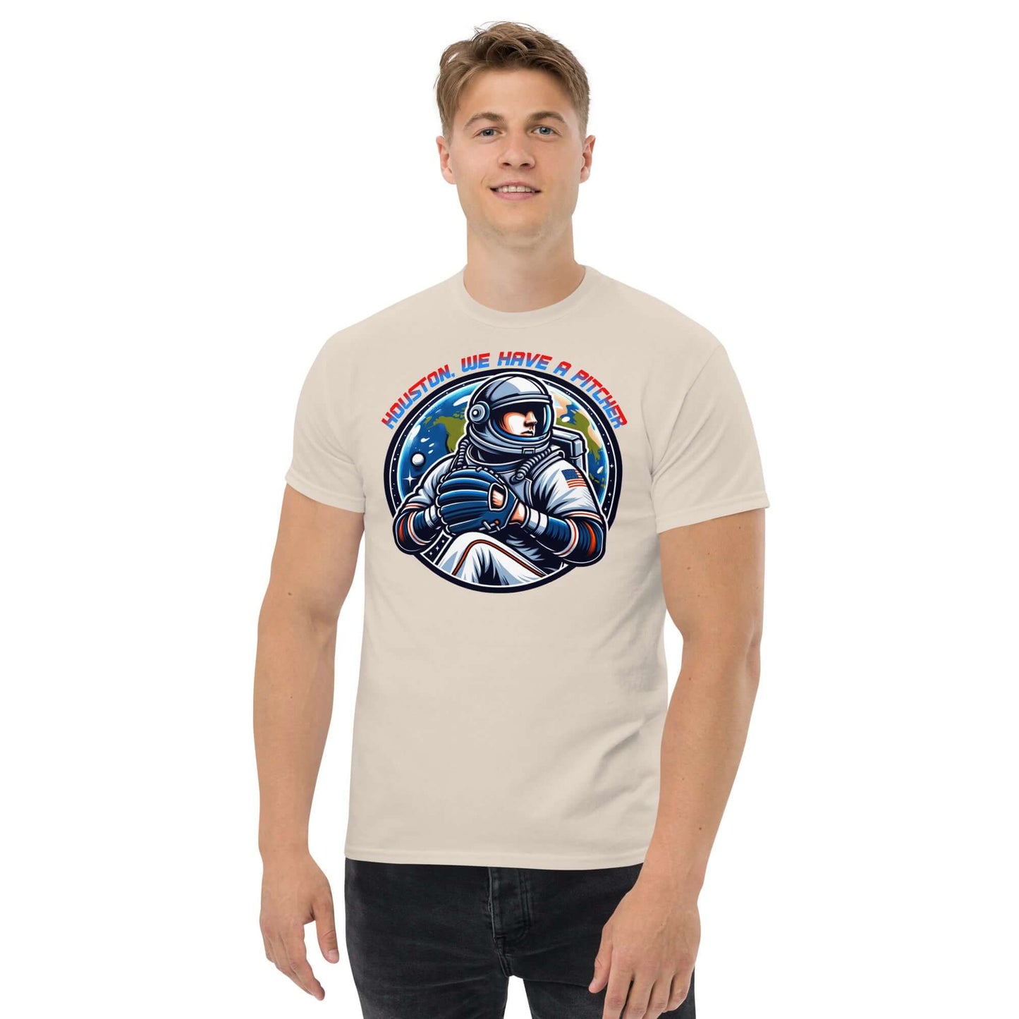 Man wearing "Houston, We Have A Pitcher" t-shirt with space athlete design by Technium Foundry, blending baseball and space program themes.