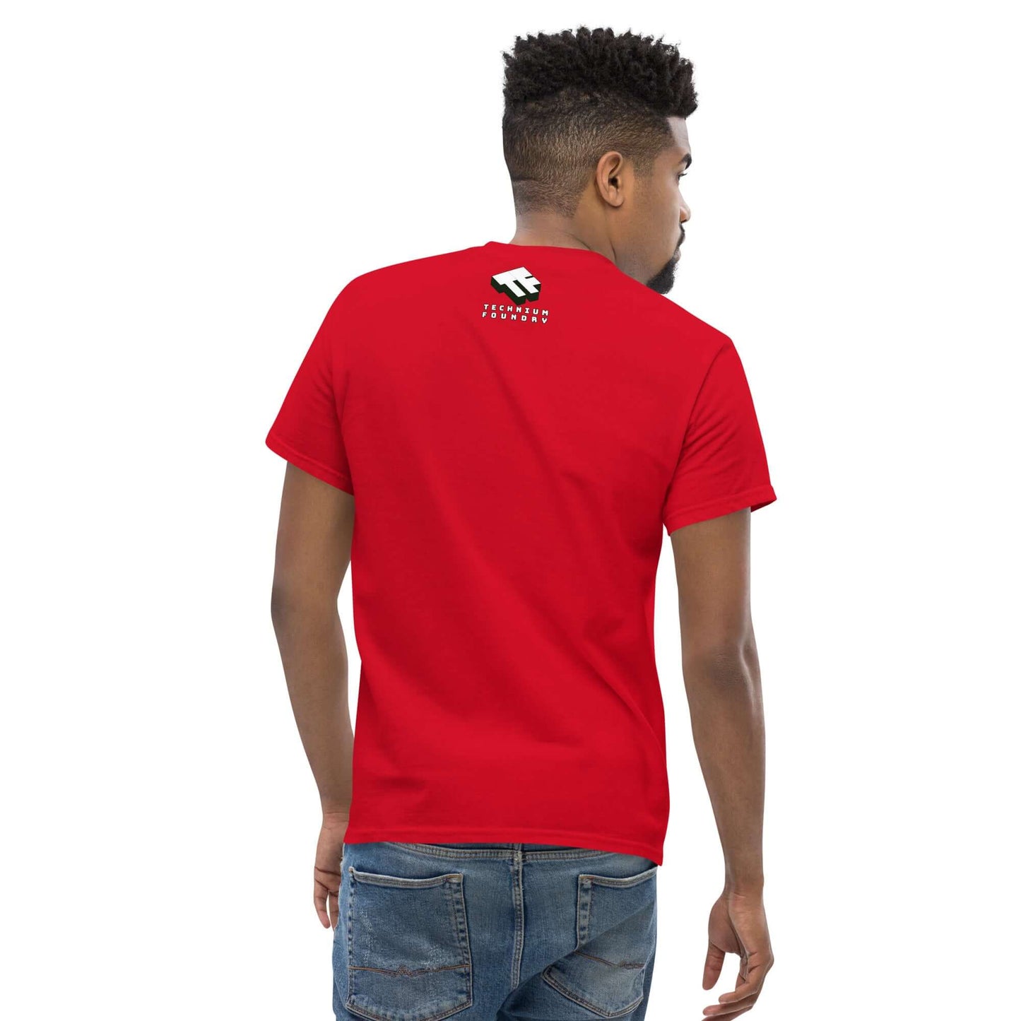 Man wearing a red t-shirt with a white geometric logo, shown from the back, paired with casual blue jeans.