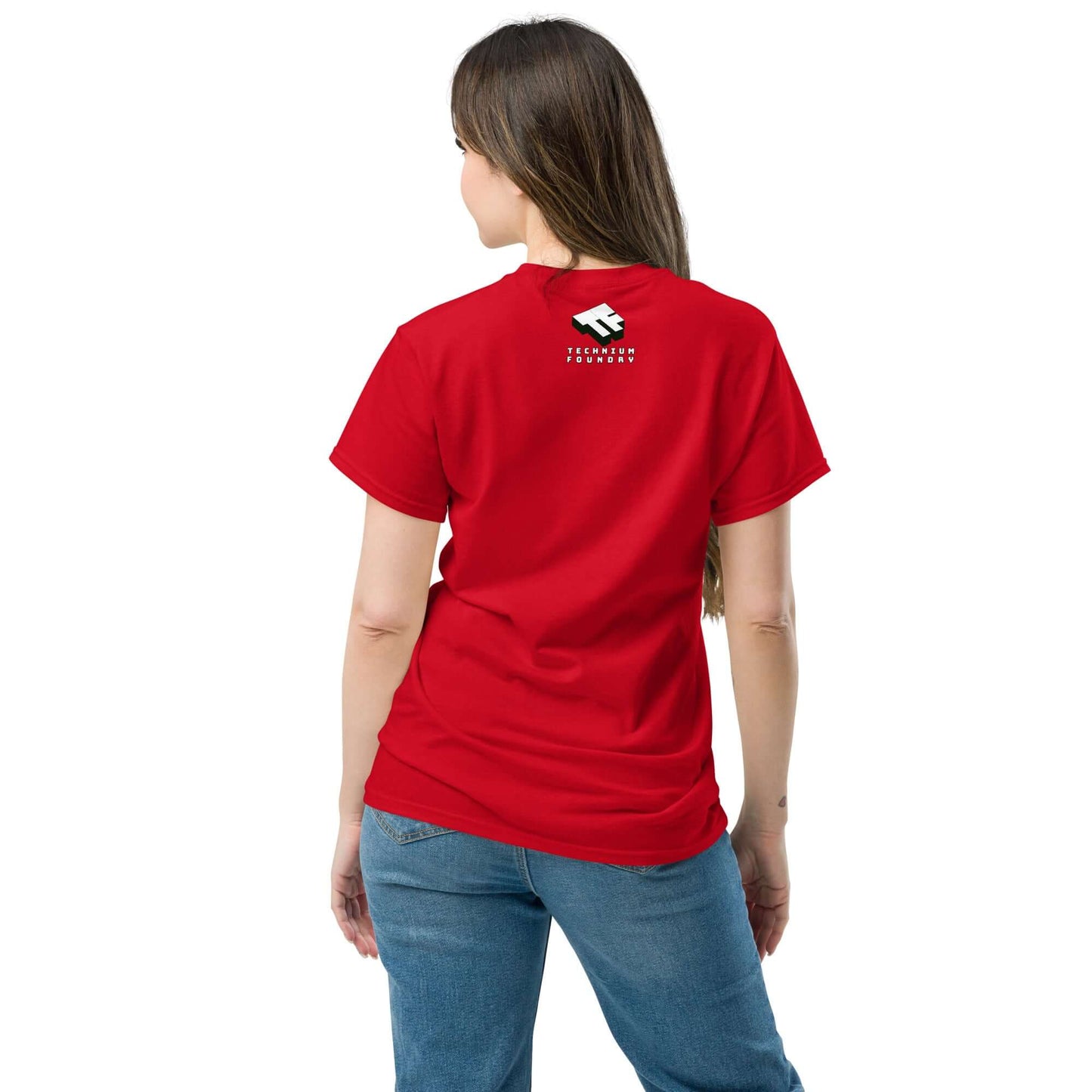 Woman in red t-shirt and jeans, viewed from the back, standing against a white background.