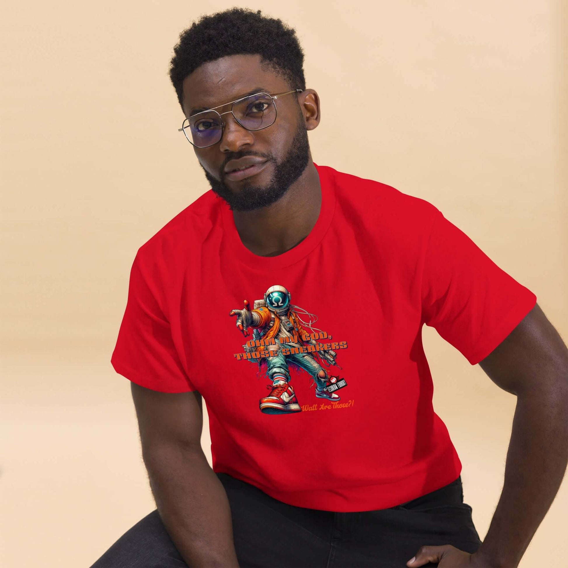 Man wearing a red "Watt Are Those?!" Electronic Kicks T-Shirt featuring a stylish astronaut design by Technium Foundry.