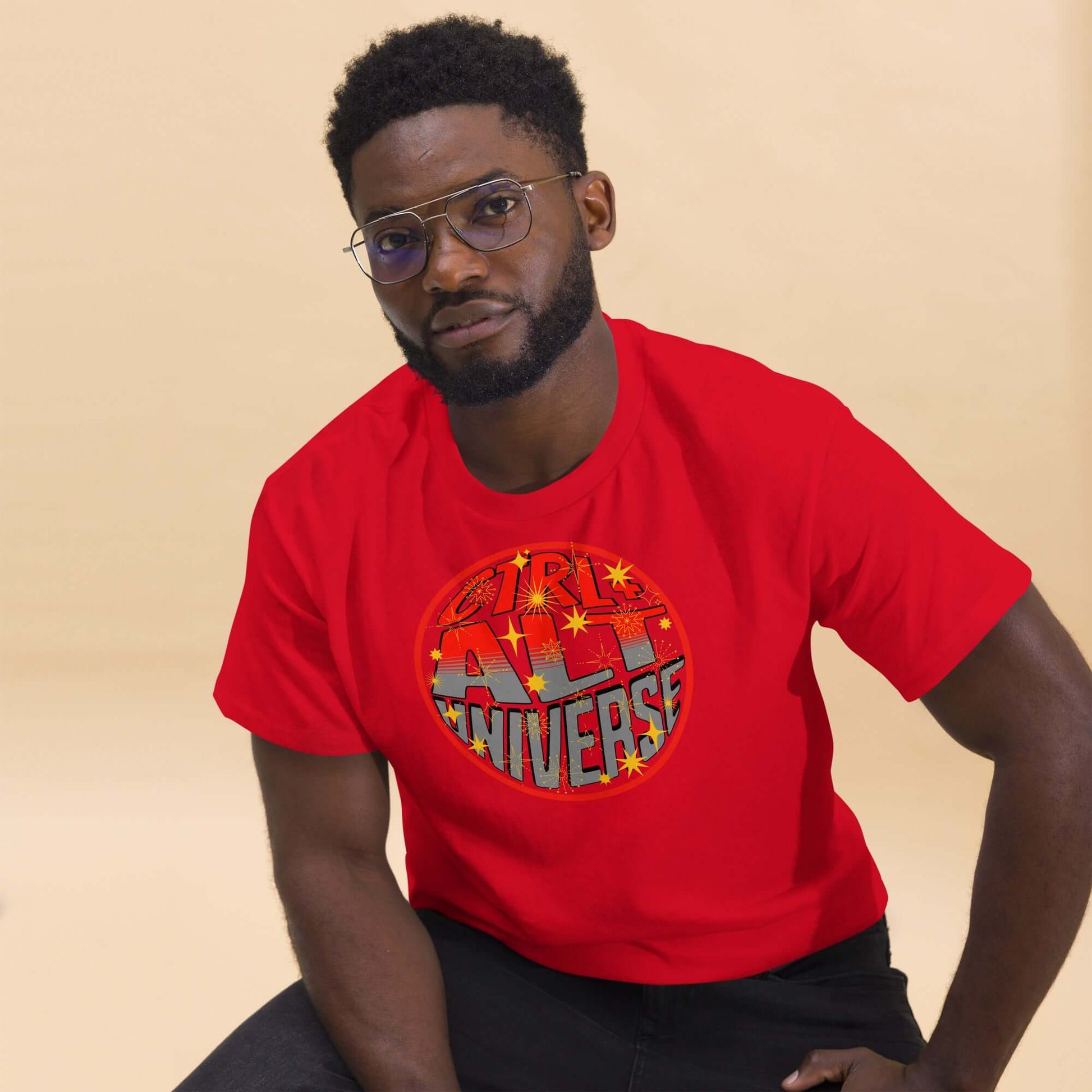 Man wearing a red CTRL + ALT UNIVERSE T-shirt, featuring a retro gaming and cosmic coding design with stars.