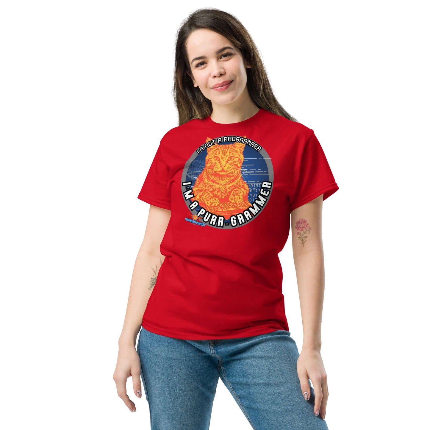 Woman wearing "The Purr-grammer's Manifesto" red tee with coding cat design. Science & Tech Apparel Collection by Technium Foundry.