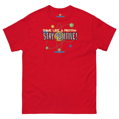 Red "Think Like a Proton, Stay Positive!" tee with particle physics and motivational design. Perfect blend of science and positivity.