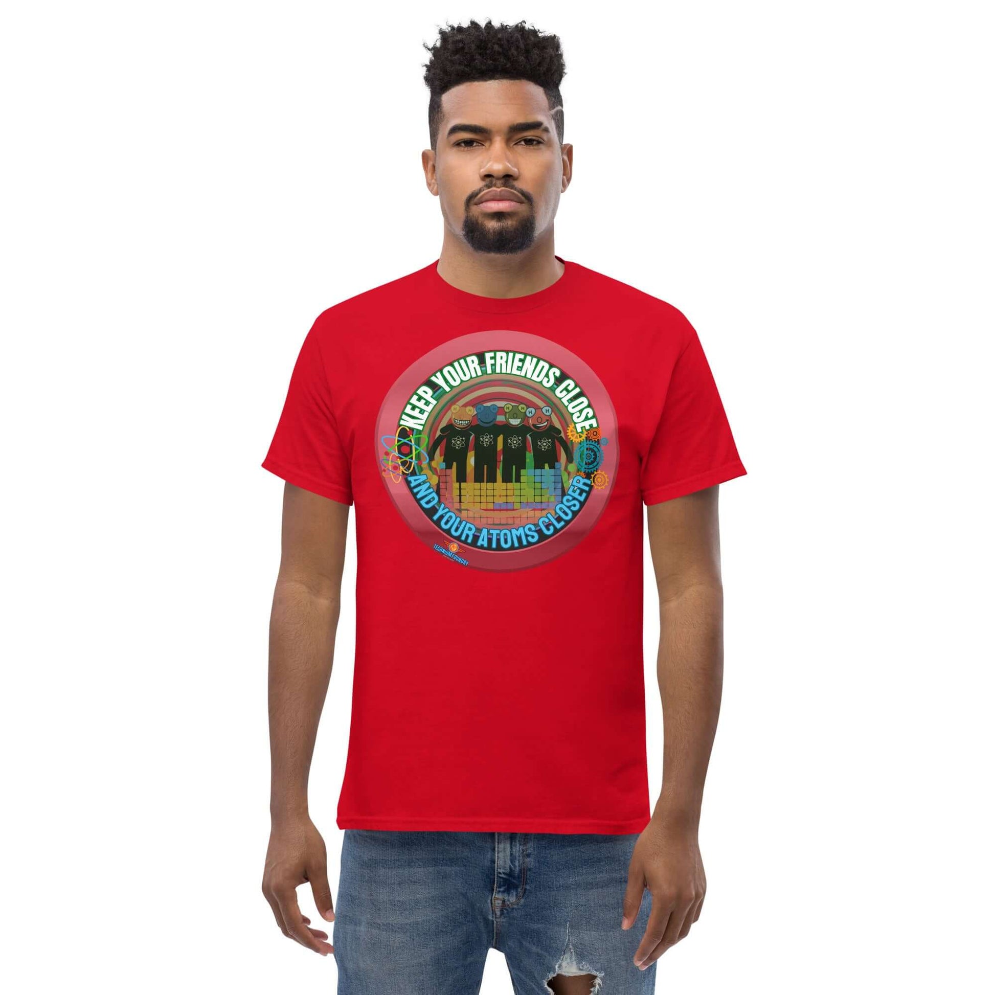 Red tee with "Keep Your Friends Close and Your Atoms Closer" design, featuring atoms in a retro circle on a cityscape backdrop.