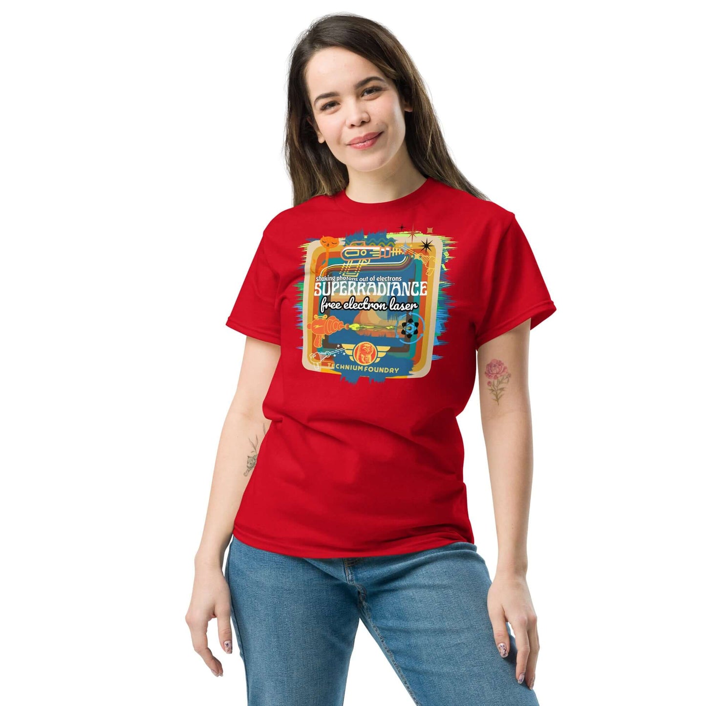 Woman wearing a red Superradiance Free Electron Laser T-shirt with a retro science design, showcasing quantum physics meets 1980s style.