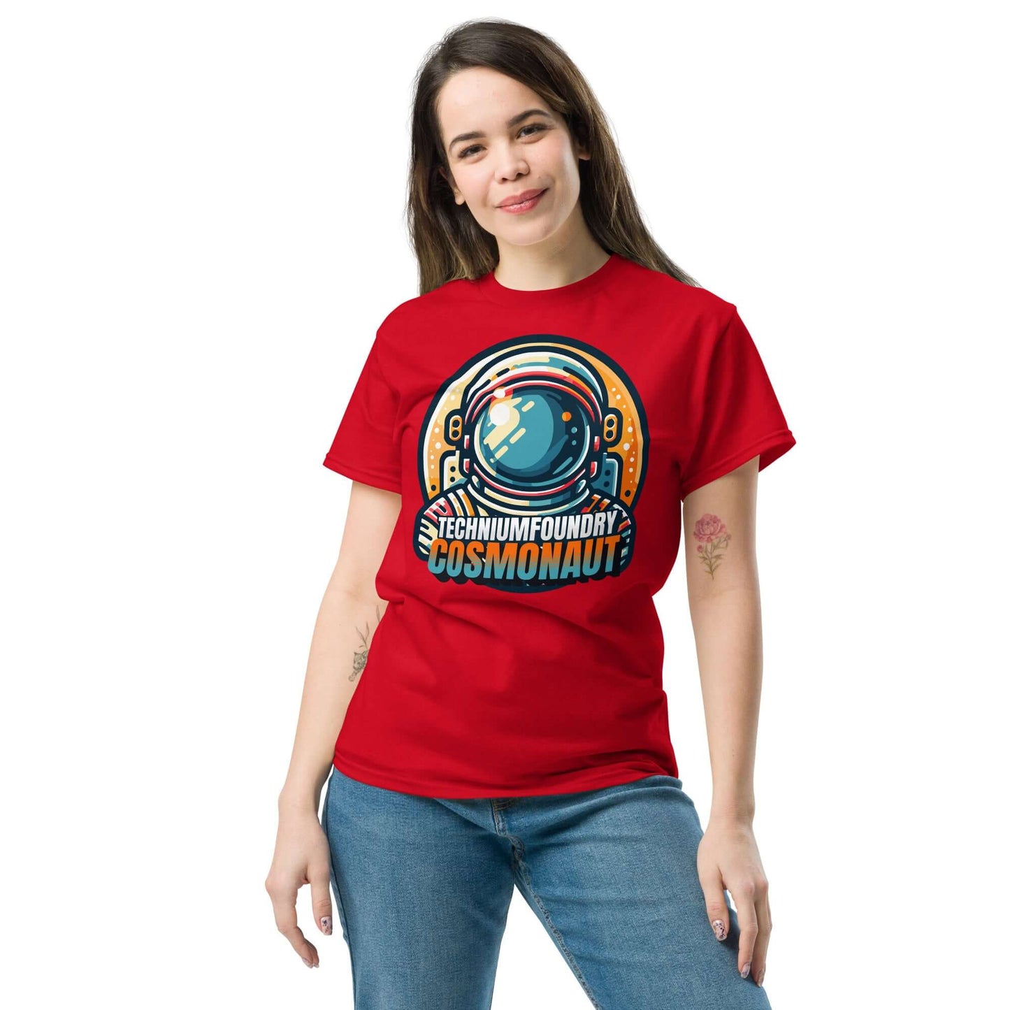 Person wearing Technium Foundry Cosmonaut T-Shirt with retro helmet design in vivid colors.