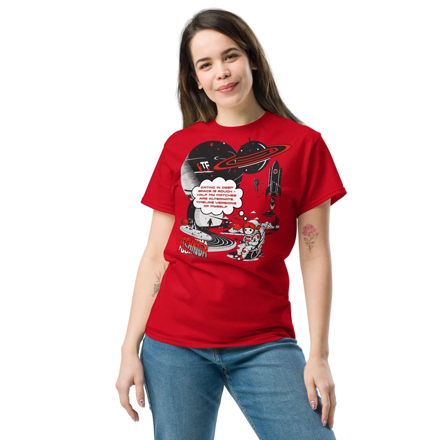 Woman wearing a red Cosmic Dating Blues T-Shirt by Technium Foundry, featuring a space-themed design with a lonely astronaut.