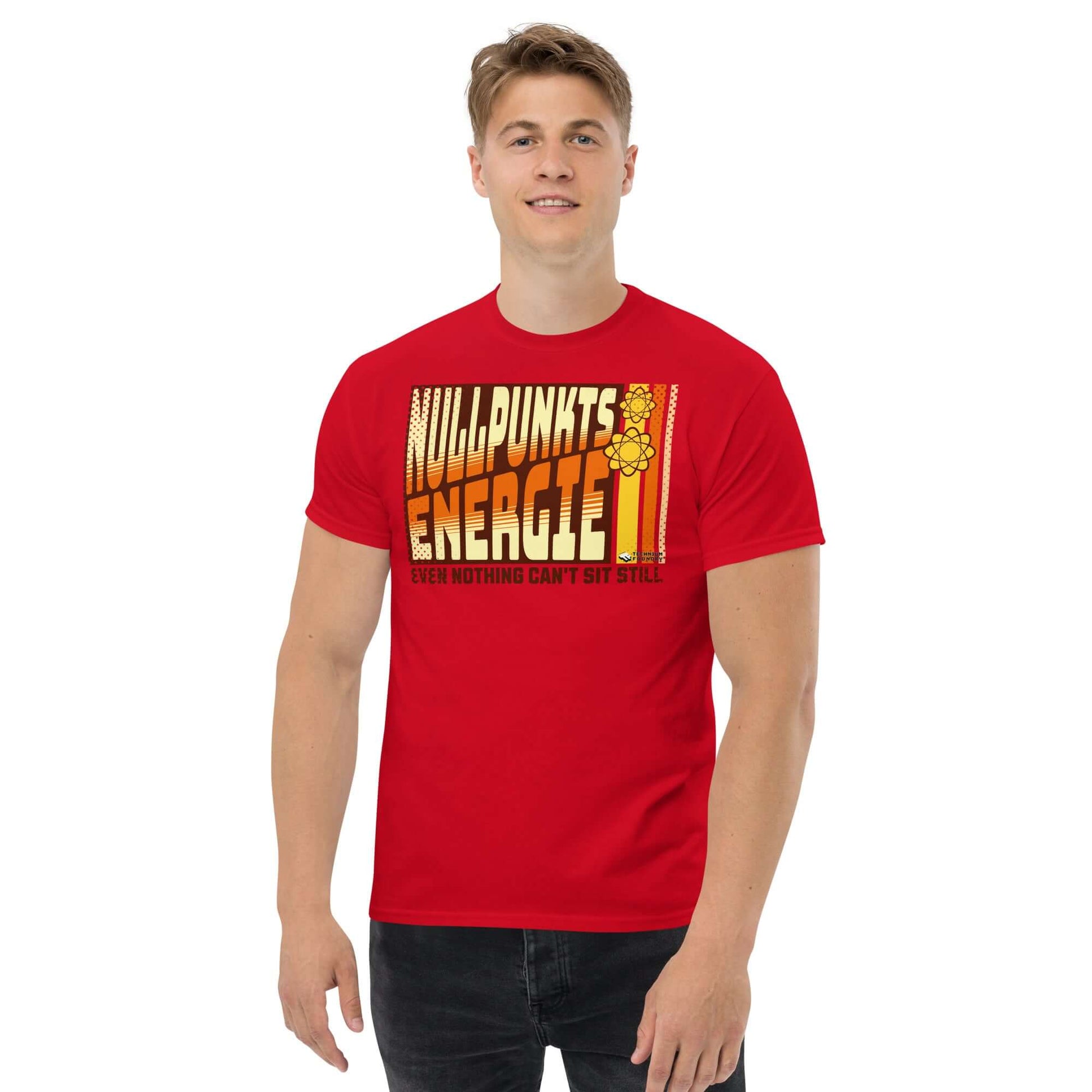 Man wearing a red Nullpunktsenergie T-shirt with retro 70s typography and atomic design, by Technium Foundry.