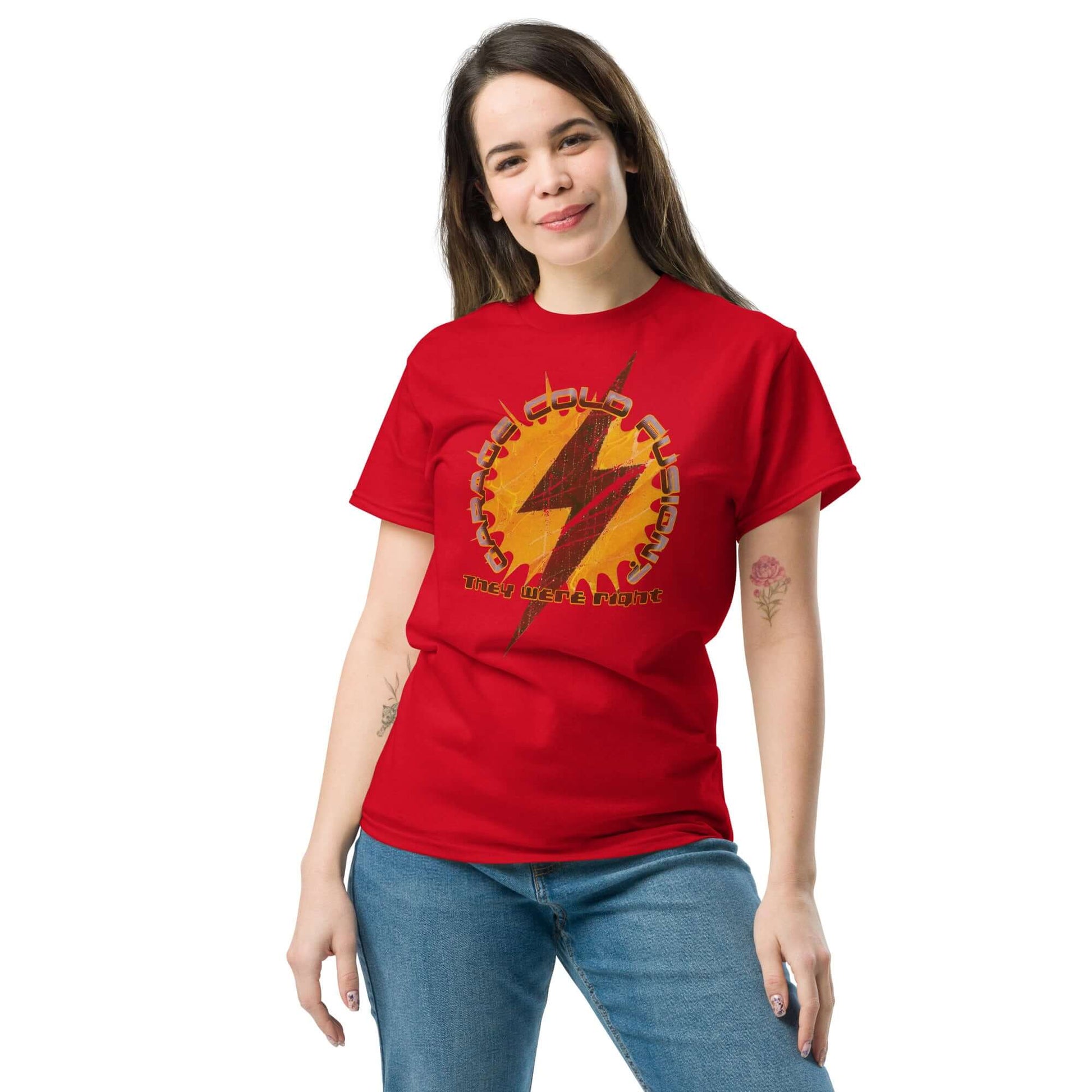 Woman wearing Garage Cold Fusion T-Shirt with lightning bolt gear design, showcasing failed science experiment humor.